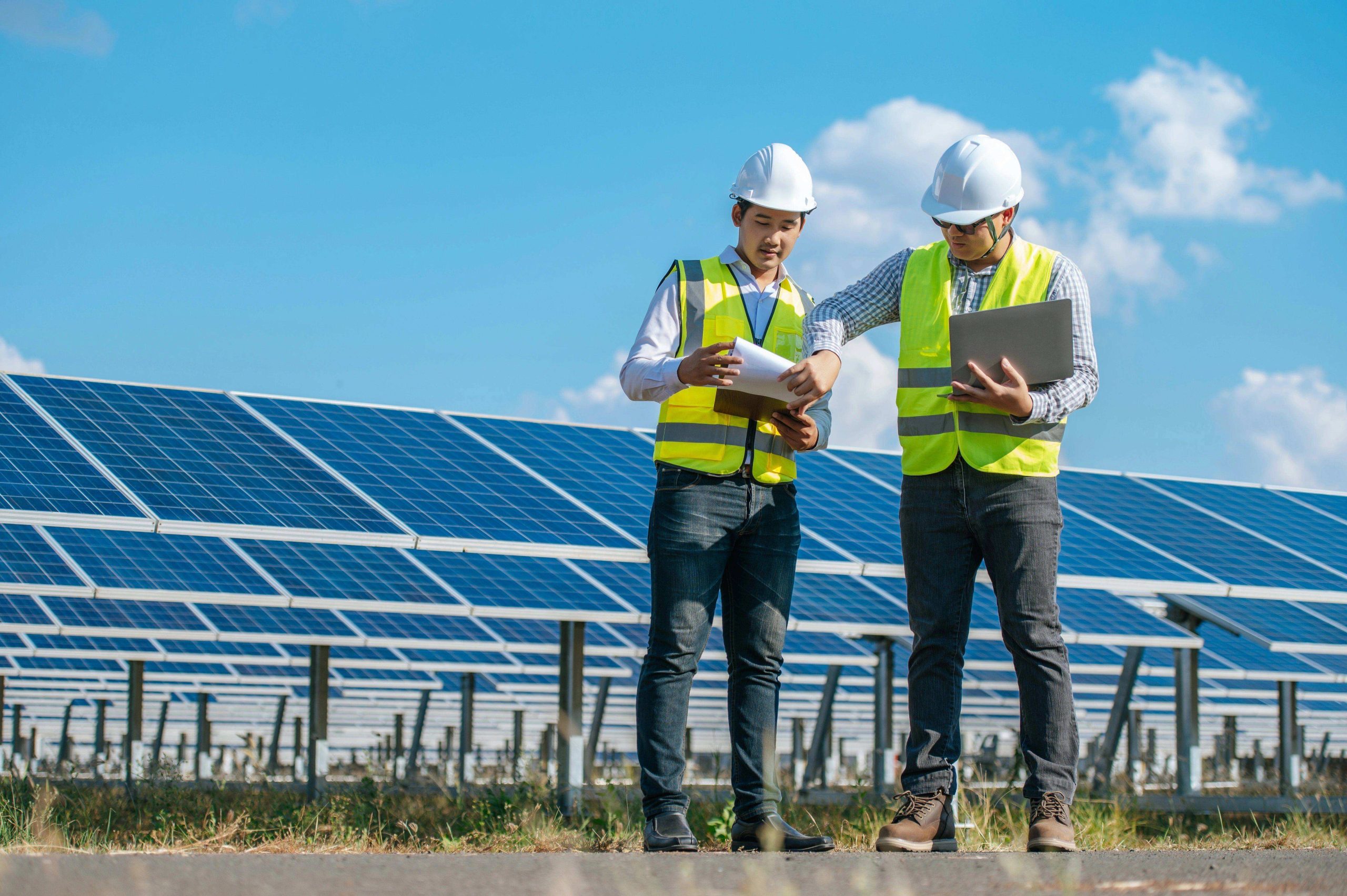Engineers inspecting solar panels for renewable energy PPA in India